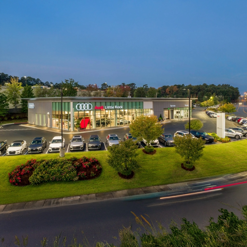 Audi Sale Specialist walking through the showroom with a couple.